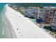Aerial view of high-rise buildings alongside a white sand beach with the ocean in the background at 17920 Gulf Blvd # 1806, Redington Shores, FL 33708
