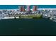 Breathtaking aerial view of beachfront condos overlooking a serene lake and the Gulf, offering stunning waterfront living at 17920 Gulf Blvd # 1806, Redington Shores, FL 33708