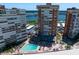 Aerial view of luxurious condos offering a pool, parking, and nearby beach access and beautiful gulf views at 17920 Gulf Blvd # 1806, Redington Shores, FL 33708