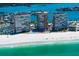Beautiful aerial shot of condo buildings with white sandy beach and emerald green waters at 17920 Gulf Blvd # 1806, Redington Shores, FL 33708