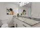 Bright bathroom featuring granite countertop, modern sink, and stylish lighting fixture above mirror at 17920 Gulf Blvd # 1806, Redington Shores, FL 33708