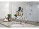 Modern bathroom with granite countertop, decorative sink, plus a vanity with plants and decor at 17920 Gulf Blvd # 1806, Redington Shores, FL 33708