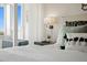 Comfortable and stylish bedroom featuring a well-decorated bed and balcony access at 17920 Gulf Blvd # 1806, Redington Shores, FL 33708