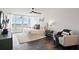 Spacious bedroom with modern decor, balcony access, and a cozy chair at 17920 Gulf Blvd # 1806, Redington Shores, FL 33708