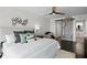 Well-lit bedroom with stylish decor, a sliding barn door, and an en-suite bathroom at 17920 Gulf Blvd # 1806, Redington Shores, FL 33708