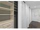 Organized closet with adjustable shelving and drawers, maximizing storage space at 17920 Gulf Blvd # 1806, Redington Shores, FL 33708