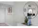Inviting hallway featuring stylish decor, leading to a kitchen with modern white cabinets and granite at 17920 Gulf Blvd # 1806, Redington Shores, FL 33708