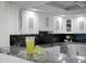 Stylish kitchen with white cabinets, granite countertops, stainless steel appliances, and beverage bar at 17920 Gulf Blvd # 1806, Redington Shores, FL 33708