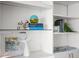 Close-up of shelving featuring tasteful decor, books, and artistic elements that add character at 17920 Gulf Blvd # 1806, Redington Shores, FL 33708