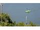 Scenic shot of a kayaker paddling through calm water, surrounded by lush greenery and tranquil scenery at 17920 Gulf Blvd # 1806, Redington Shores, FL 33708