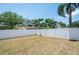 Spacious backyard with a privacy fence, perfect for outdoor activities and entertaining at 1818 Willow Oak Dr, Palm Harbor, FL 34683