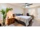 Bedroom with a plant, desk, and shutters at 1818 Willow Oak Dr, Palm Harbor, FL 34683