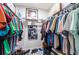 Walk-in closet features ample hanging and storage space for organizing clothes and accessories at 1818 Willow Oak Dr, Palm Harbor, FL 34683