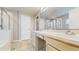 Bathroom featuring double sinks, walk in shower, and tile floors at 19635 Bellehurst Loop, Land O Lakes, FL 34638