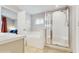 Bathroom featuring double sinks, walk in shower, and tile floors at 19635 Bellehurst Loop, Land O Lakes, FL 34638