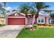 Charming single-Gathering home featuring a well-maintained lawn and beautiful palm tree landscaping at 19635 Bellehurst Loop, Land O Lakes, FL 34638