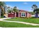 Landscaped home boasts beautiful lawn, front garden, and exterior color scheme at 19635 Bellehurst Loop, Land O Lakes, FL 34638