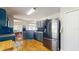 Modern kitchen features stainless steel appliances, granite countertops and dark blue subway tile backsplash at 19635 Bellehurst Loop, Land O Lakes, FL 34638