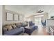 Spacious living room with comfortable seating, modern ceiling fan, and sliding glass doors to the backyard at 19635 Bellehurst Loop, Land O Lakes, FL 34638