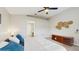 Comfortable main bedroom featuring a ceiling fan, neutral walls, plush carpet, and a king size bed at 19635 Bellehurst Loop, Land O Lakes, FL 34638