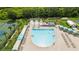 Aerial view of the luxurious pool with sun loungers and covered seating areas at 19635 Bellehurst Loop, Land O Lakes, FL 34638