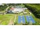 Aerial view of a community pool, basketball courts, and clubhouse at 19635 Bellehurst Loop, Land O Lakes, FL 34638