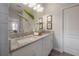 The bathroom offers double sinks, a granite countertop, and modern fixtures, creating a tranquil and functional space at 212 Villa Luna Ln, Lutz, FL 33549