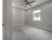 Bedroom featuring neutral carpet, a ceiling fan, and a bright window, offers a tranquil and inviting space at 212 Villa Luna Ln, Lutz, FL 33549