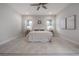 Bright bedroom with a ceiling fan, plush carpet, and neutral decor offers a serene and inviting retreat at 212 Villa Luna Ln, Lutz, FL 33549