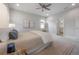 Relaxing bedroom with soft carpet, ensuite bathroom access, and modern decor provides a comfortable living space at 212 Villa Luna Ln, Lutz, FL 33549