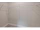 Walk-in closet with wire shelving presents an organized storage solution at 212 Villa Luna Ln, Lutz, FL 33549