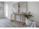 Inviting entryway with stylish console table, modern decor, and attractive flooring creating a welcoming first impression at 212 Villa Luna Ln, Lutz, FL 33549