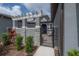 View of the front entrance and decorative pergola at 212 Villa Luna Ln, Lutz, FL 33549