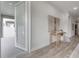 Hallway leading to the outside patio and features decorative table and art at 212 Villa Luna Ln, Lutz, FL 33549
