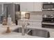 Beautiful kitchen sink with elegant fixtures and ample counter space for meal preparation at 212 Villa Luna Ln, Lutz, FL 33549
