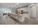 Spacious kitchen with modern appliances, large island, and seamless flow to dining area at 212 Villa Luna Ln, Lutz, FL 33549
