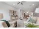 Open-concept living room flows to the dining area and kitchen in this modern home at 212 Villa Luna Ln, Lutz, FL 33549