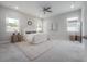 Serene main bedroom with neutral tones, plush bedding, and ample natural light at 212 Villa Luna Ln, Lutz, FL 33549