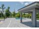 The community pool surrounded by a fenced area and trees at 212 Villa Luna Ln, Lutz, FL 33549