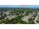 Scenic aerial view of a residential neighborhood in Safety Harbor, surrounded by lush greenery and tranquil waterways at 2750 Edenwood St, Clearwater, FL 33759