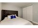 Bedroom with a tufted headboard, closet, and bright natural light at 2750 Edenwood St, Clearwater, FL 33759