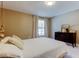 Bedroom featuring neutral walls, black dresser, and light-filled window at 2750 Edenwood St, Clearwater, FL 33759