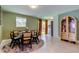 Elegant dining area with stylish table and chairs, with sliding glass door access to back at 2750 Edenwood St, Clearwater, FL 33759