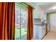 Updated kitchen with stainless steel appliances, white cabinets, granite countertops and a view of the landscaped yard at 2750 Edenwood St, Clearwater, FL 33759