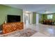 Open-concept living area with stylish console and access to the dining room at 2750 Edenwood St, Clearwater, FL 33759