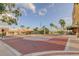 Entrance to Safety Harbor Resort & Spa with lush landscaping, palm trees, and a brick-paved intersection at 2750 Edenwood St, Clearwater, FL 33759
