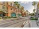 Charming street in Safety Harbor lined with brick buildings, palm trees, shops, and parked cars at 2750 Edenwood St, Clearwater, FL 33759