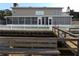 Screened in porch overlooks the fenced in backyard and dock on the water at 31 Freshwater Dr, Palm Harbor, FL 34684