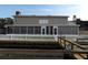Screened in porch overlooks the fenced in backyard and dock on the water at 31 Freshwater Dr, Palm Harbor, FL 34684