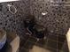 Modern bathroom features black tiling at 31 Freshwater Dr, Palm Harbor, FL 34684